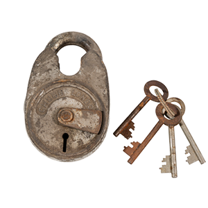 Old Rusted Padlock next to Several Rusted keyus on key chain