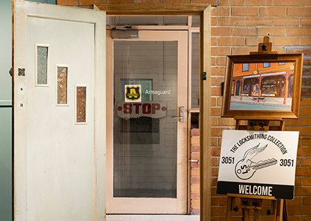 Glass entry door with Armaguard sticker